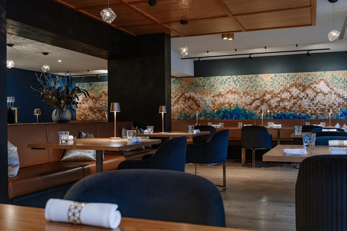Restaurant Glacier Grindelwald fine dining room with contemporary design, boutique hotel restaurant in Grindelwald, Switzerland