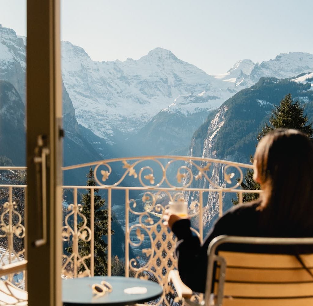 View from Grand Hotel Belvedere Wengen overlooking the Lauterbrunnen Valley and Jungfrau mountains from a private balcony.